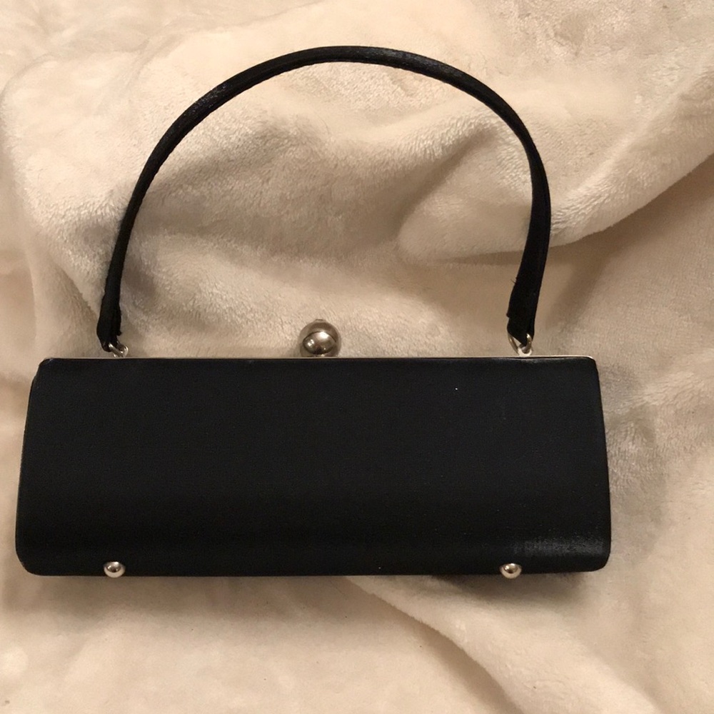 Classy Timeless Black Clutch Silver metal details.